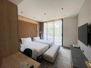 Ένα ή περισσότερα κρεβάτια σε δωμάτιο στο Layan Green Residence by ShowProperty