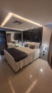 Ένα ή περισσότερα κρεβάτια σε δωμάτιο στο Imperial Flat Tambau +18 φωτογραφίες