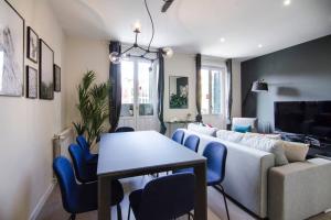 A television and/or entertainment centre at Minty Stay - 3 BD Lavapies