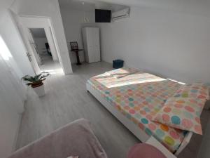 Postel nebo postele na pokoji v ubytování Casa AnaMaria