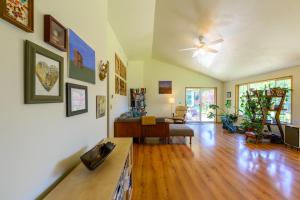 a living room with a couch and a table at River House - 4 bedroom, 2 bath private home in Eugene