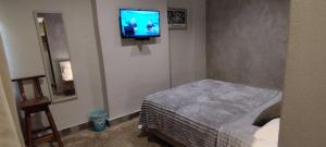 Una cama o camas en una habitación de Taguato