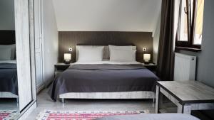 Postel nebo postele na pokoji v ubytování OISHE Boutique Hotel
