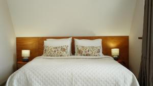 Postel nebo postele na pokoji v ubytování OISHE Boutique Hotel