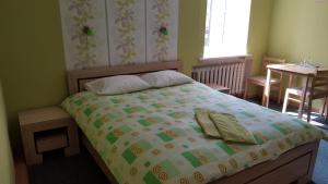 Postel nebo postele na pokoji v ubytování Hotel in Kraslava
