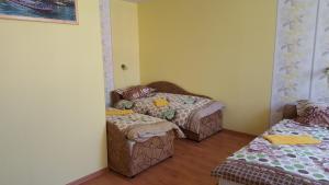 Postel nebo postele na pokoji v ubytování Hotel in Kraslava