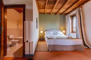 Postel nebo postele na pokoji v ubytování Relais Macconago
