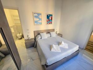 Posteľ alebo postele v izbe v ubytovaní GUVANO Luxury Apartments