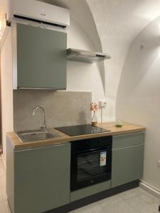 Kuchyň nebo kuchyňský kout v ubytování F&F Room