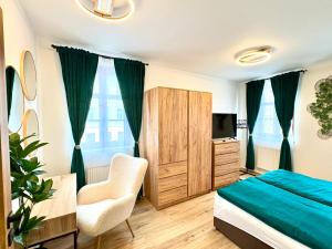 Postel nebo postele na pokoji v ubytování Apartmány ASYMETRIK s parkováním a možností snidaně