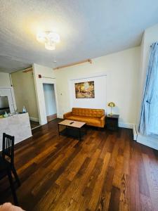 a living room with a couch and a table at One bedroom near Whole Foods, Brown Univeristy, Miriam Hospital 531 in Providence