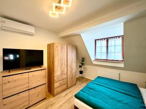 Postel nebo postele na pokoji v ubytování Apartmány ASYMETRIK s parkováním a možností snidaně