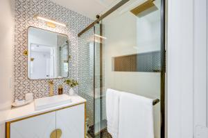 a bathroom with a sink and a shower at Walk to The Village ShopsandEats Big Bear Lake Home in Big Bear Lake +23 photos