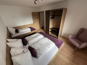 A bed or beds in a room at Studler-Eck
