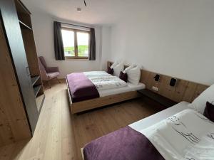 A bed or beds in a room at Studler-Eck