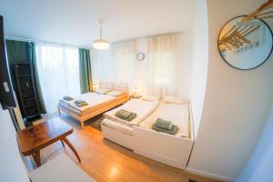 a living room with a bed and a couch at Prague Camping Dzban in Prague