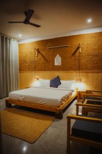 a bedroom with a large bed and a ceiling at Ethnic Trail Homestay in Bhīm Tāl