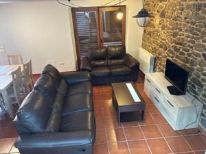 TV a/nebo společenská místnost v ubytování Casa de Outes