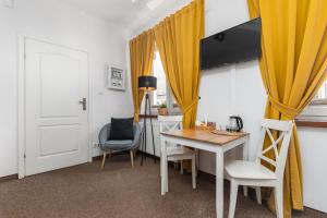 a dining room with a table and chairs at Hostel Coco in Warsaw