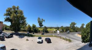 a parking lot with a bunch of cars parked in it at Florida Sunshine in Ardea