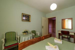 a room with a table and two chairs and a table and a table and chairs at Rooms Mirjana in Trogir