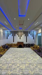 a large room with a stage and a fireplace at جنة الطائف in Taif +95 photos