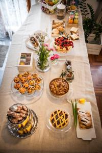 a long table with many plates of food on it at B&B Villa Ngiolò "vista mare" in Ancona