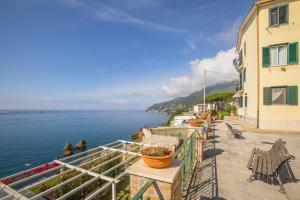a view of the ocean from a balcony of a building at casa Ferrigno in Vietri sul Mare