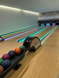 a bowling alley with balls on the lanes at Resort Premium Salinas in Salinópolis
