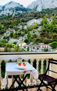 a table on a balcony with a view of a mountain at Le Terrazze Sul Pollino B&B in Civita +186 photos