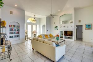 a living room with a couch and a table at Pool, Spa and Dock Waterfront Tarpon Point Home in Cape Coral
