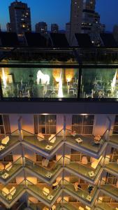 an aerial view of a building with tables and chairs at Essence Hotel Boutique in Torremolinos