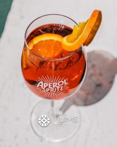a drink in a glass with an orange slice at The Lume Boutique Hotel & Restaurant & Spa in Bodrum City