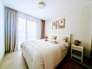 Ένα ή περισσότερα κρεβάτια σε δωμάτιο στο Verano en Blue Maritimo Casares +44 φωτογραφίες