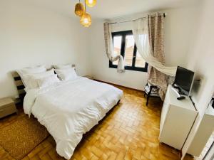 Ένα ή περισσότερα κρεβάτια σε δωμάτιο στο Maison Rosy