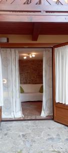 A bed or beds in a room at Casa Caterina - Riva di Solto - Iseo Lake
