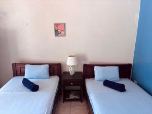Postel nebo postele na pokoji v ubytování Casitas de la Paz