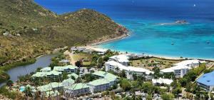 an aerial view of a resort next to the ocean at Le Nid Bohème -Anse Marcel in Anse Marcel 