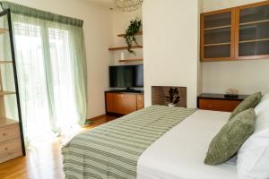 Postel nebo postele na pokoji v ubytování Zenmar - Modern Residence in the heart of Zante town