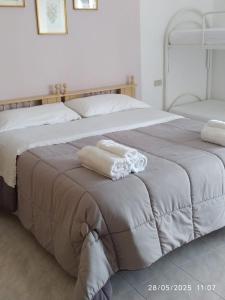 Postel nebo postele na pokoji v ubytování Casa vacanze Aielli Risorgimento
