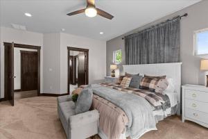 a bedroom with a bed and a ceiling fan at Winston's Luxurious Retreat in Coeur d'Alene