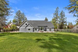 a house with a large yard at Winston's Luxurious Retreat in Coeur d'Alene
