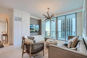 a living room with a couch and chairs at Amrit Resort - Bask in Rare Oceanfront Luxury with Stunning Views in Riviera Beach +18 photos