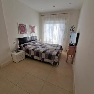 Ένα ή περισσότερα κρεβάτια σε δωμάτιο στο Apartament INES +11 φωτογραφίες