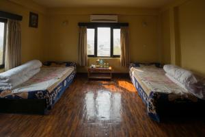 Voodi või voodid majutusasutuse Planet Bhaktapur Hotel toas