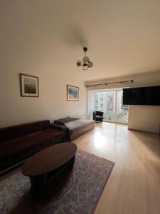 Ruang duduk di Cozy Maumedziu apartment