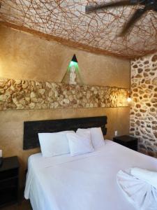 Postel nebo postele na pokoji v ubytování Habitaciones Colonial Zaci