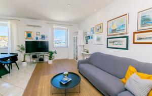a living room with a couch and a table at Apartment Ljerka in Postira