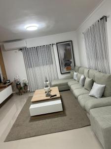 a living room with a couch and a coffee table at Residencial JL Francia II in Ensanche Savica de Mendoza +7 photos