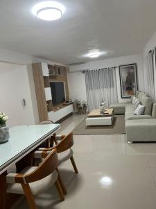 a living room with a couch and a table and chairs at Residencial JL Francia II in Ensanche Savica de Mendoza